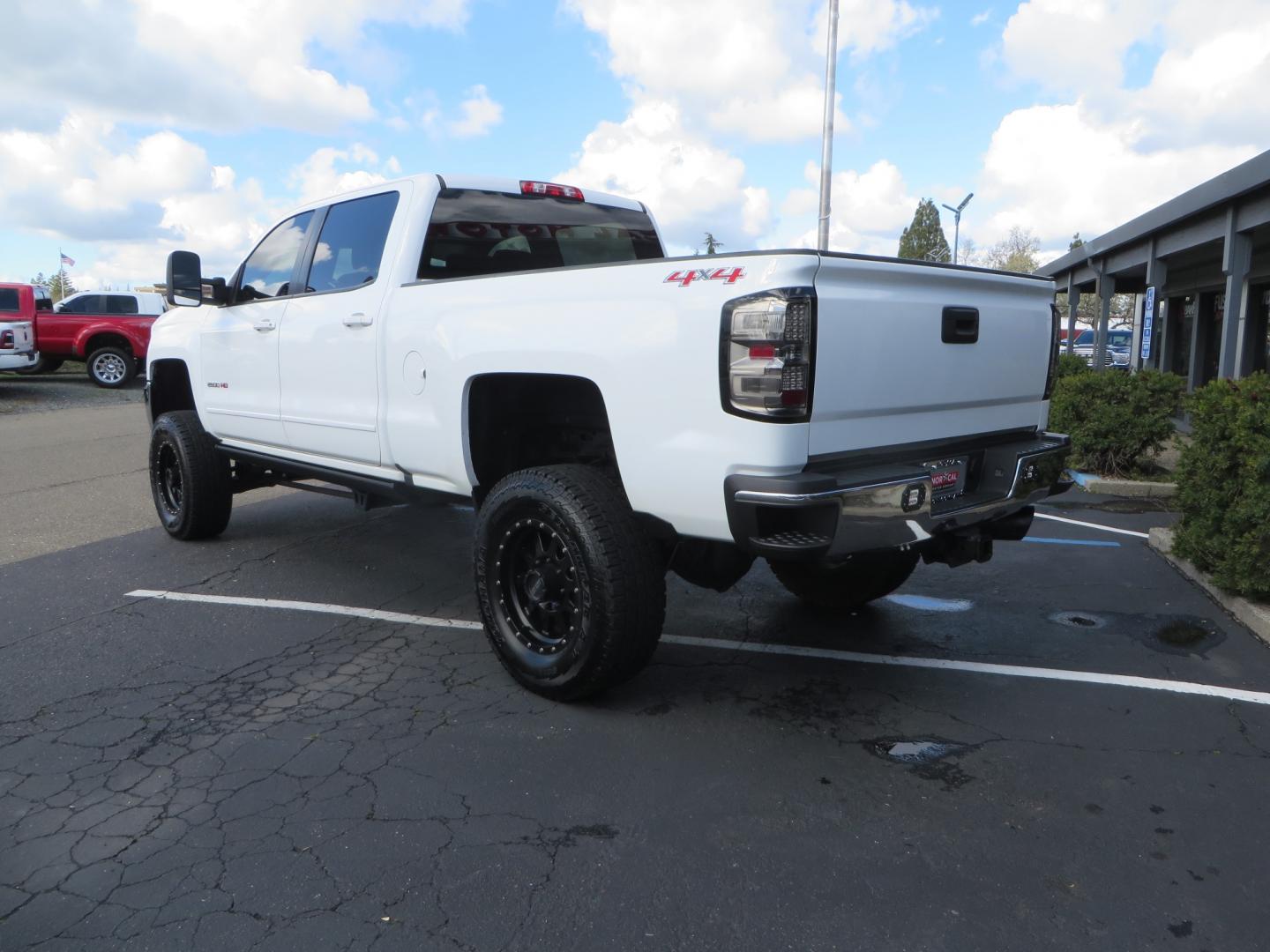 2016 White /Gray Chevrolet Silverado 2500HD LT Crew Cab 4WD (1GC1KVE81GF) with an 6.6L V8 OHV 32V TURBO DIESEL engine, 6A transmission, located at 2630 Grass Valley Highway, Auburn, CA, 95603, (530) 508-5100, 38.937893, -121.095482 - Features- Pro Comp suspension, Method Race wheels, Yokohama tires, Amp steps, Fox remote reservoir shocks, Air Bags, Smoked tail lights, LED back up lights, Weathertech floor liners, and window tint. - Photo#6